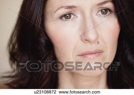 Stock Image - woman looking into distance. Fotosearch