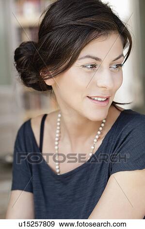 woman looking over her shoulder View Large Photo Image Stock Photo - woman looking over her shoulder. Fotosearch