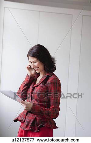 Stock Photo - woman making phone call. Fotosearch