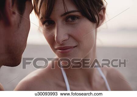 woman next to a man looking at viewer View Large Photo Image Stock Image - woman next to a man looking at viewer. Fotosearch