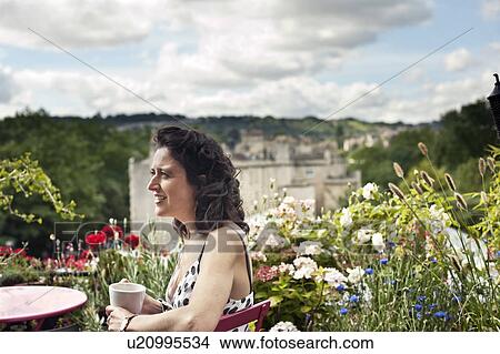 woman on balcony drinking tea View Large Photo Image Picture - woman on balcony drinking tea. Fotosearch