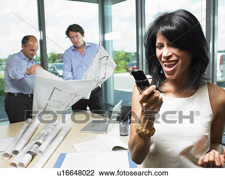 Woman on the phone, men with blue prints View Large Photo Image Stock Image - Woman on the phone, men with blue prints. Fotosearch