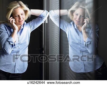 Picture - Woman on the phone. Fotosearch