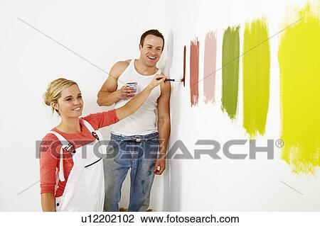 Woman painting colour swatches on wall View Large Photo Image Stock Image - Woman painting colour swatches on wall. Fotosearch
