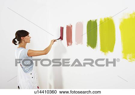 Woman painting colour swatches on wall View Large Photo Image Stock Image - Woman painting colour swatches on wall. Fotosearch