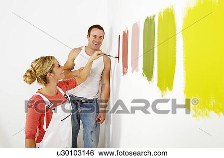 Woman painting colour swatches on wall View Large Photo Image Stock Photograph - Woman painting colour swatches on wall. Fotosearch