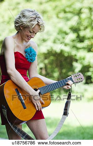 woman playing guitar View Large Photo Image Stock Photograph - woman playing guitar. Fotosearch