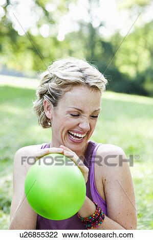 woman playing with balloon laughing View Large Photo Image Stock Image - woman playing with balloon laughing. Fotosearch