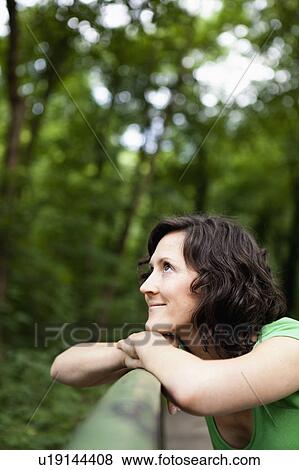 Stock Photo - Woman Relaxing In The Woods. Fotosearch