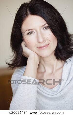 woman resting head on hand View Large Photo Image Picture - woman resting head on hand. Fotosearch