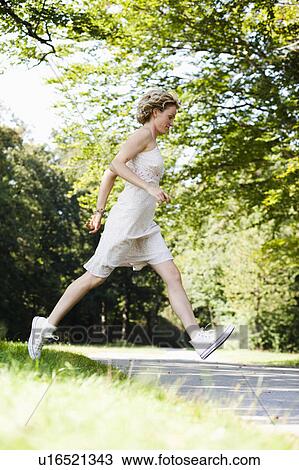 woman running in park View Large Photo Image Stock Image - woman running in park. Fotosearch