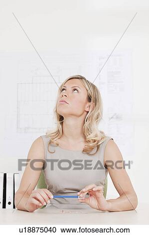 Woman sharpening her pencil View Large Photo Image Stock Image - Woman sharpening her pencil. Fotosearch