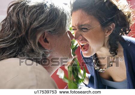 Stock Image - woman shouting at man. Fotosearch