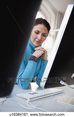 woman sitting at terminal View Large Photo Image Stock Image - woman sitting at terminal. Fotosearch