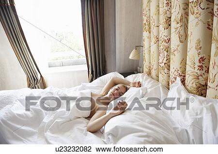 Woman sleeping in bed View Large Photo Image Stock Image - Woman sleeping in bed. Fotosearch