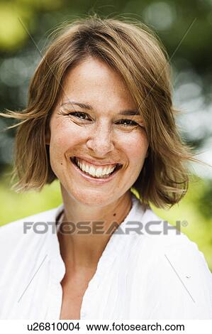 Picture - woman smiling at viewer. Fotosearch