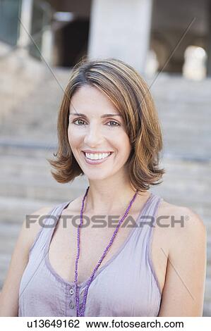 woman smiling at viewer View Large Photo Image Stock Image - woman smiling at viewer. Fotosearch