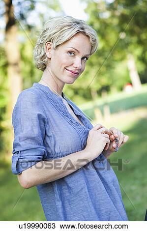 woman smiling at viewer View Large Photo Image Stock Image - woman smiling at viewer. Fotosearch