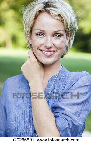 woman smiling at viewer View Large Photo Image Stock Image - woman smiling at viewer. Fotosearch