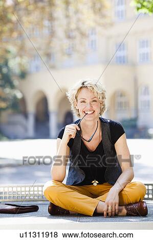 woman smiling at viewer View Large Photo Image Stock Photo - woman smiling at viewer. Fotosearch