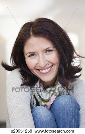 Stock Photo - woman smiling at viewer. Fotosearch
