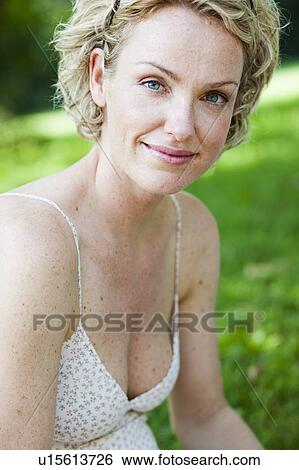 Stock Photograph - woman smiling at viewer. Fotosearch