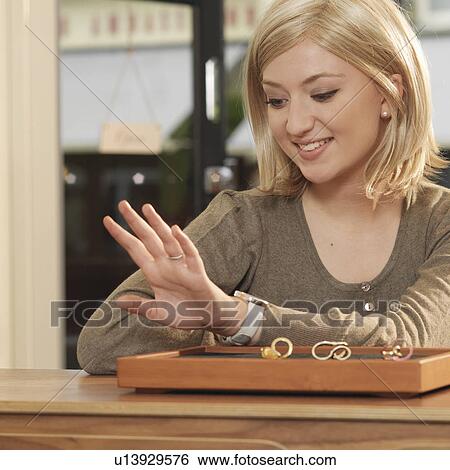 woman trying on ring View Large Photo Image Stock Photograph - woman trying on ring. Fotosearch
