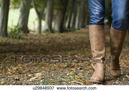 Stock Photo - woman walking in countryside. Fotosearch