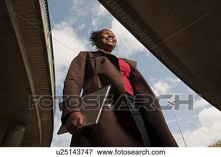Stock Photo - woman walking to work. Fotosearch
