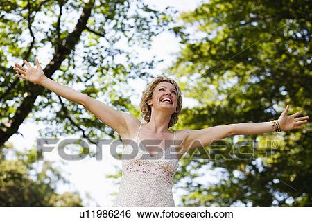 woman with arms wide open View Large Photo Image Stock Photograph - woman with arms wide open. Fotosearch