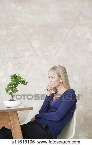 woman with bonsai View Large Photo Image Stock Photograph - woman with bonsai. Fotosearch
