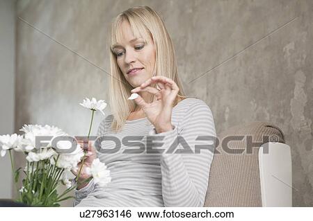 Stock Photograph - woman with flowers. Fotosearch