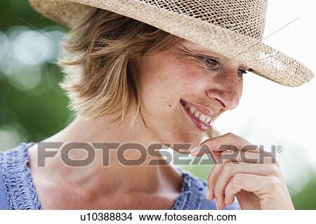 woman with hat smiling View Large Photo Image Picture - woman with hat smiling. Fotosearch