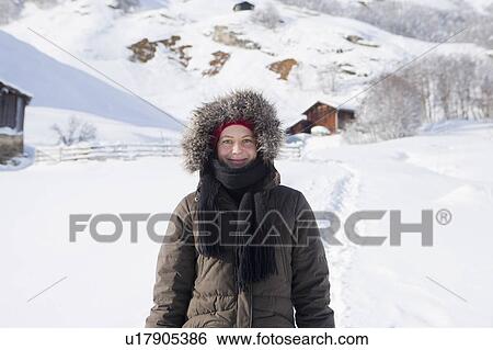 Stock Photograph - Woman with hooded jacket . Fotosearch