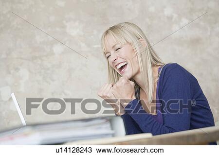 woman with laptop cheering View Large Photo Image Stock Image - woman with laptop cheering. Fotosearch