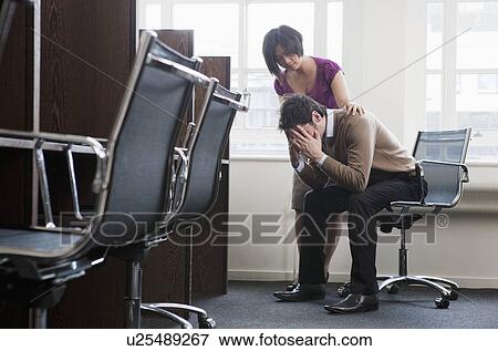 Women consoling a man View Large Photo Image Stock Photo - Women consoling a man. Fotosearch