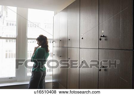 Stock Photo - Women in a locker room. Fotosearch