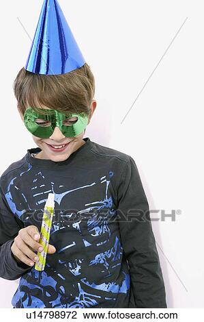 young boy laughing with a sarbacane View Large Photo Image Stock Image - young boy laughing with a sarbacane. Fotosearch