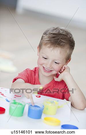 young boy playing with colours View Large Photo Image Stock Image - young boy playing with colours. Fotosearch