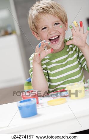 young boy playing with colours View Large Photo Image Stock Photo - young boy playing with colours. Fotosearch