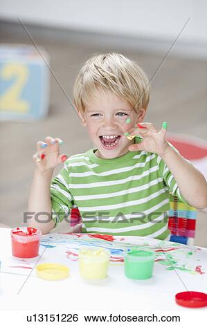 young boy playing with colours View Large Photo Image Stock Photograph - young boy playing with colours. Fotosearch