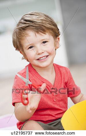 young boy playing with scissors View Large Photo Image Stock Photo - young boy playing with scissors. Fotosearch