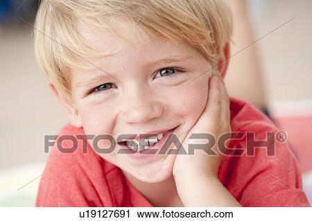 Stock Image - young boy smiling at viewer. Fotosearch