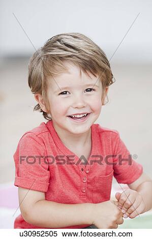 young boy smiling at viewer View Large Photo Image Stock Photography - young boy smiling at viewer. Fotosearch