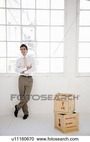 Stock Image - Young businessman starting enterprise. Fotosearch