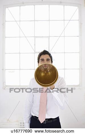 Stock Image - Young businessman starting enterprise. Fotosearch
