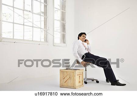 Stock Image - Young businessman starting enterprise. Fotosearch
