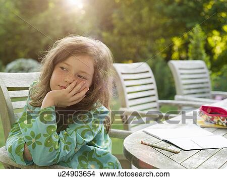 Young girl daydreaming in garden View Large Photo Image Picture - Young girl daydreaming in garden. Fotosearch