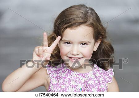 young girl holding up three fingers View Large Photo Image Picture - young girl holding up three fingers. Fotosearch