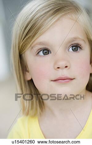 Stock Image - young girl looking interested. Fotosearch